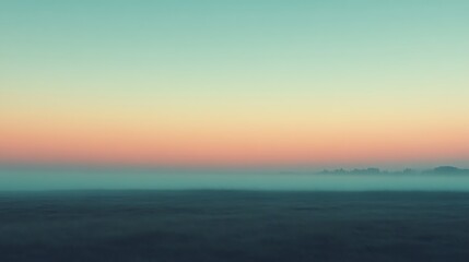 Obraz premium Serene Sunrise Over Foggy Fields And Trees