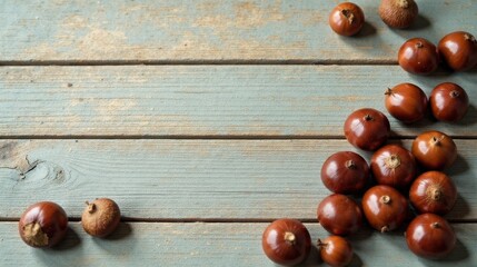 Naklejka premium Rustic Wooden Surface Adorned with a Bountiful Cluster of Smooth, Dark Brown Nuts