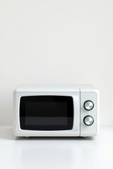 Fototapeta premium there is a white microwave sitting on a white table