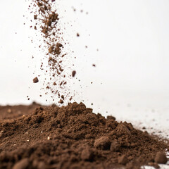 falling soil isolated on blank background 