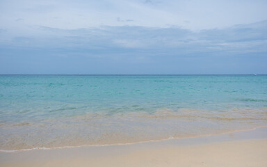 Obraz premium Landscape image of tropical white beach with blue sea and sky background