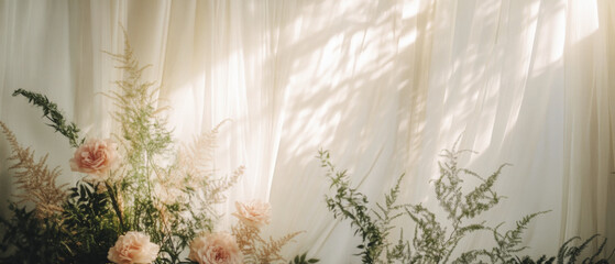 soft, whimsical wedding backdrop featuring delicate flowers and greenery. light filters through sheer fabric, creating