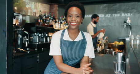 Portrait, barista and woman with service, confidence and happiness with skills, apron and pride. Face, employee at counter people in restaurant, friendly or hospitality with welcome or business owner