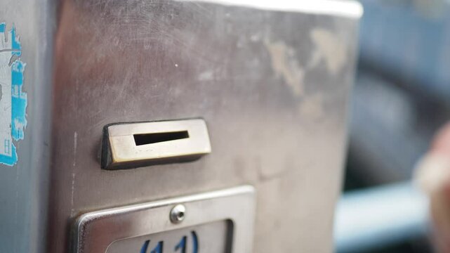 How to insert a coin into a public parking meter