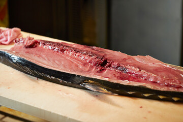 Raw tuna chunks on a cutting board