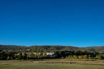 Fototapeta premium clear blue skies and Colorado mountainsides 