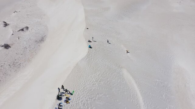 Aerial view of tourists on a sand dune in the desert near Lancelin, Western Australia