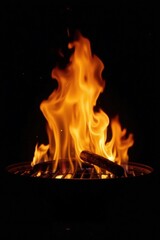 A sizzling sausage on a grill, engulfed in vibrant flames during a nighttime cookout.