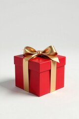 Fototapeta premium A vibrant red gift box adorned with a luxurious gold ribbon, perfect for celebratory occasions and conveying heartfelt wishes