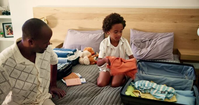 Dad, kid and packing suitcase in home for holiday trip, weekend getaway and teaching independence. Black family, man and luggage preparation on bed with travel clothes, helping and learning support