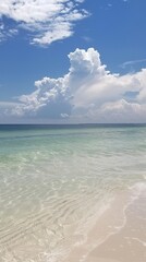 Serene ocean scene with crystal-clear waters and white sandy beaches, showcasing the beauty of nature's landscapes. Blue sky with fluffy clouds adds to the picturesque appearance
