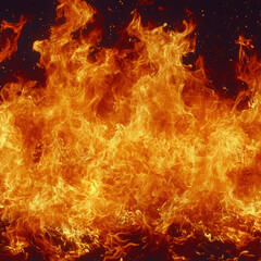 Fototapeta premium Intense flames engulfing dark background, suitable for danger or heat concepts