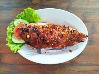 Grilled salmon steak with vegetables