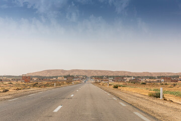 A long, straight through a salt lake in Tunisia