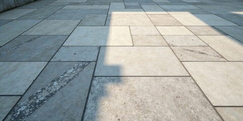 Sunlit Pavement Geometric Pattern of Light and Shadow on a Large-Format Stone Tile Surface