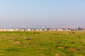 A distant city in front of a meadow, in Tunisia