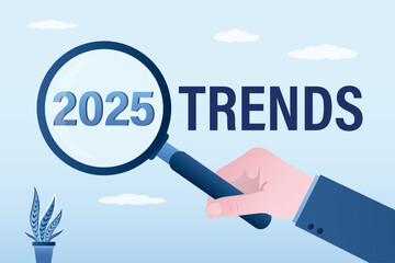 Magnifying glass analyzing 2025 trends. Forecasting, vision of future success, new year achievement targets, smart businessman looking magnifying glass for 2025 for prospects.