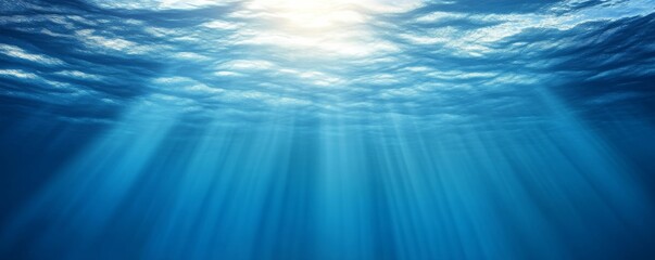 Obraz premium Underwater scene with sunlight rays penetrating the deep blue ocean, tranquility and natural beauty concept