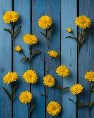 Fototapeta premium yellow flowers on wooden background