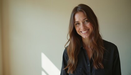 Smiling young woman in black shirt against neutral background, perfect for lifestyle blogs