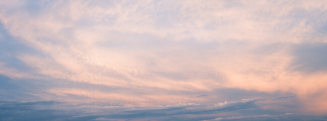 Cirrus cloud with sunset light over blue sky.  nature wallpaper  background.