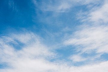 Fototapeta premium Cirrus cloud with sunset light over blue sky. nature wallpaper background.