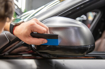 The process of installing PPF matte film on the side of the car. PPF is a polyurethane, protective...
