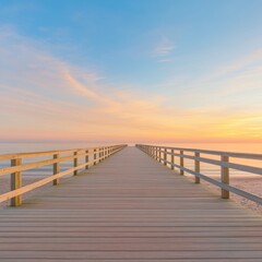 Obraz premium Long Wooden Pier Stretching Over Soft Sand at Sunset by the Sea