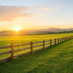 Obraz premium Serene Rustic Fence Alongside Lush Green Field at Sunset