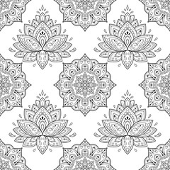 Seamless decorative ornament in ethnic oriental style. Lotus flower and mandala for Henna, Mehndi, tattoo, decoration. Doodle outline hand draw vector illustration.