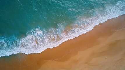 High Angle View Of Ocean Waves Crashing On Golden Beach