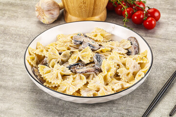 Italian cuisine - farfalle with mushrooms