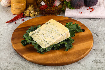 Blue cheese piece over board