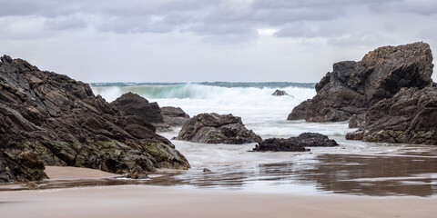 Fototapeta premium Rocks with sandy beach at low tide in the bay of Sango Sands, Durness, Scotland, Europe