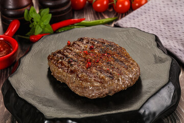 Grilled beef burger cutlet with sauce