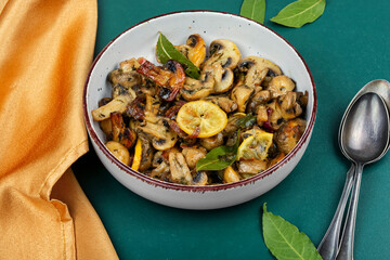 Delicious fried mushrooms in bowl.