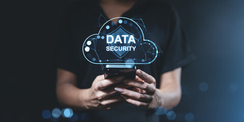 Data security concept with a glowing cloud hologram over a smartphone.