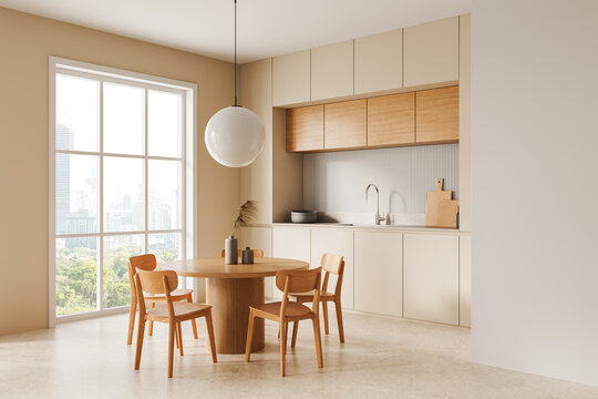 Modern dining area with wooden furniture and neutral-toned kitchen cabinets. 3D Rendering
