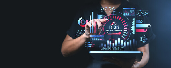 Digital risk management concept with interactive graphs and charts on a tablet.