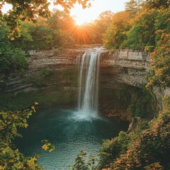 A picturesque waterfall cascading down a lush cliff, surrounded by greenery 
