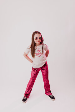 Young girl looks directly at camera with soft expression