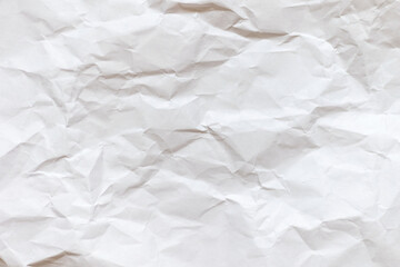 A sheet of white crumpled paper. Abstract background