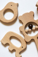 These organic baby teethers are perfect for your little one! They're made with a white background and come in a set of wooden toys. 