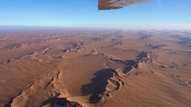Aerial view of the Namib desert with fog at sunrise in Namibia, Africa.
