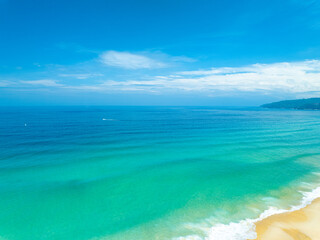 Aerial view of blue sea surface water texture background,Sun reflections on water, Aerial flying drone view Waves water surface texture on sunny tropical ocean in Phuket island Thailand
