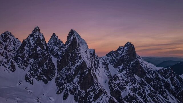 Majestic Sunset over Snowy Mountain Peaks