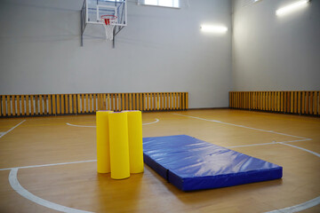 sports equipment and a mat in the gym