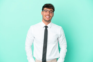 Business caucasian man isolated on blue background laughing