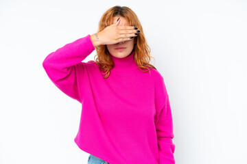 Young caucasian woman isolated on white background covering eyes by hands. Do not want to see...