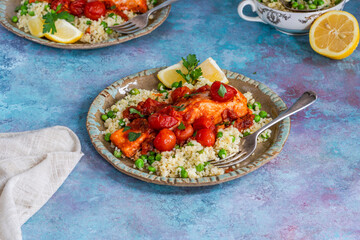 Harissa salmon with bulgur wheat, cherry tomatoes and green peas